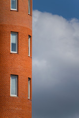 Close-up of architectural details and window of an old building against the blue sky, background or concept
