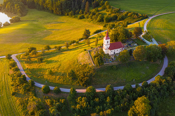 Church on the hill with sunlit summer landscape. Bysicky church near SPA town Lazne Belohrad, Czech Republic