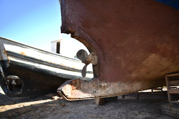 rusty yacht propeller ashore