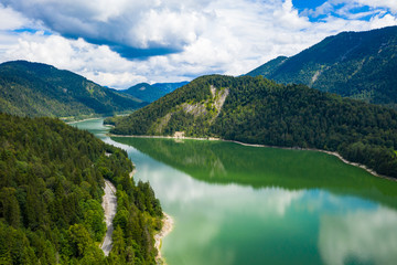 Fototapeta na wymiar Aerial view of Sylvenstein Lake on cloudy summer day