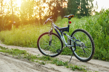 Fototapeta premium beautiful mountain bicycle on green nature background on sunset