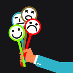 insincere businessman holding universal set of emotional masks 