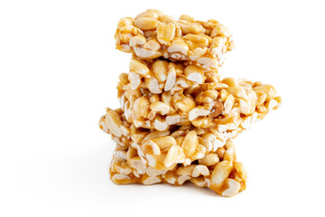 Peanut Brittle bars (Indian Peanut Chikki) isolated on white background.