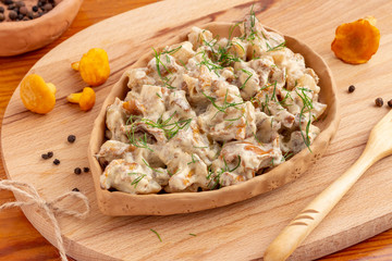 Chanterelle mushrooms fried in sour cream. National Russian dish.