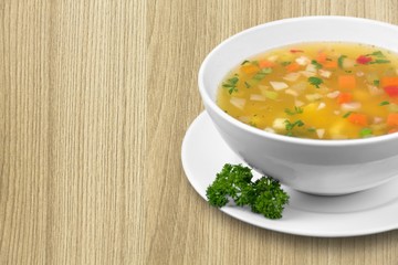 Bowl of delicious vegetable soup on a table