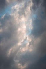 Fototapeta na wymiar clouds and sunrays in summer 