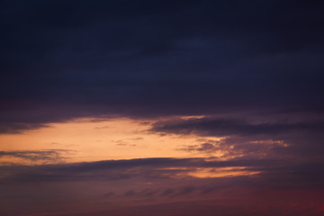 dark sunset with cloudy sky