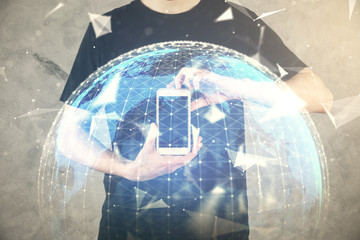 Double exposure of man's hands holding and using a phone and international business theme drawing.