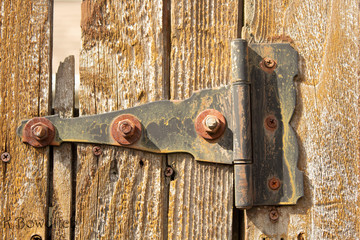 Old hinge on fence gate