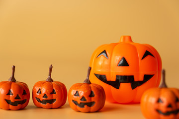 Happy Halloween, Pumpkins on orange background, halloween concept. Copy space.