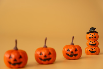 Happy Halloween, Pumpkins on orange background, halloween concept. Copy space.