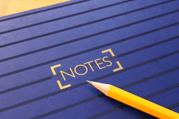 Closeup of a notebook and pencil 