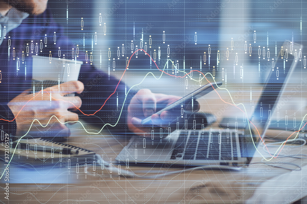 Poster double exposure of man's hands holding and using a phone and financial graph drawing. analysis conce