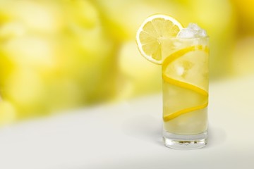 Lemonade with fresh slice lemon on desk