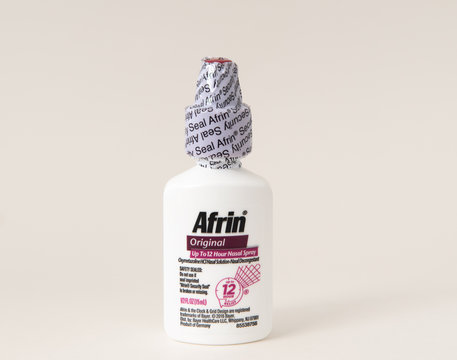 Davis, CA, Aug 16, 2020. Sealed bottle of Afrin nose drops for nasal congestion relief, nasal spray, 12 hours, isolated on white background