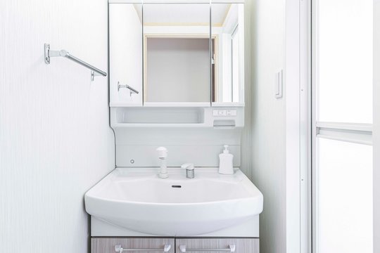 close-up white basin in modern bathroom