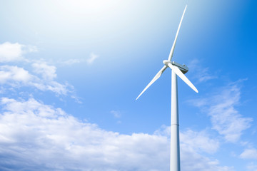 Fototapeta premium Alternative Energy Concepts. Windmill Outdoors Against Blue Sky