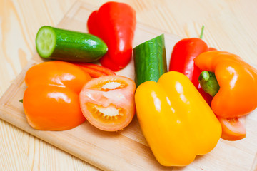 Healthy and Organic Food Concepts. Variety of Fresh Vegetables placed on Wooden Plate in Bulk.
