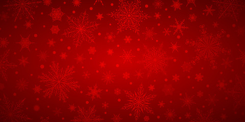 Fototapeta na wymiar Christmas background of various complex big and small snowflakes, in red colors