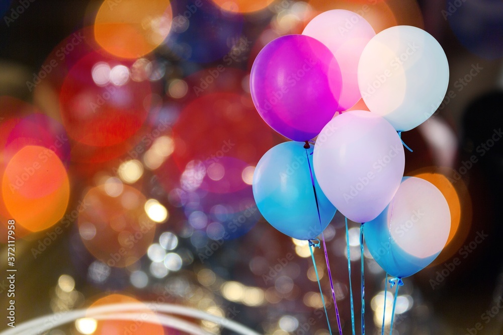 Sticker Bunch of colorful balloons on bokeh background