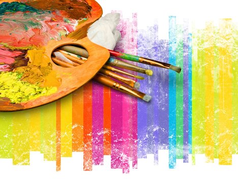 Dirty palette with artist paint brushes on a colored background