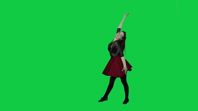 Full body view on  professional dancer dancing in front of a green screen