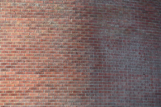 Red brick wall on city septic building.