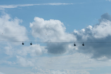 Cable cars with clouds in background. Minimal landscape shot