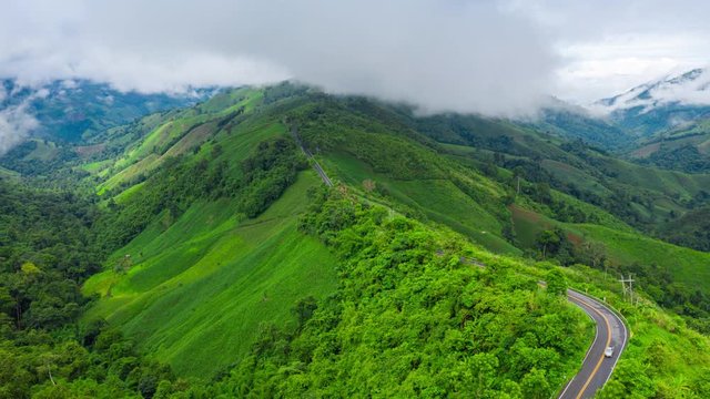 Hyperlapse of Beautiful sky road over top of mountains with green jungle in Nan province, Thailand.