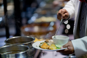 scooping the food, catering, dinner time
