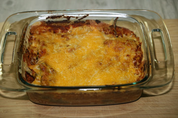 A baked chile relleno casserole with melted cheese on top.