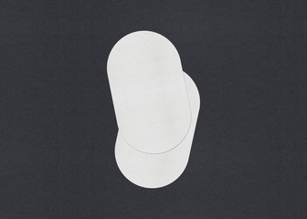 Blank white Business card mockup stacks on grey textured paper background.