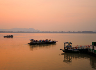 A ferry carrying passengers sailing in river Brahmaputra in Guwahati, Assam