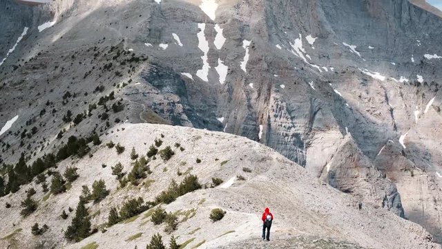 Adventurous Hiker Crosses The HIgh Alpine Plateau In Mount Olympus In Greece - Tilt-Up Shot