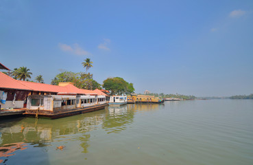 Fototapeta na wymiar House boats parked in Kollam ferry terminal on Ashtamudi lake.