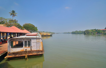 Fototapeta na wymiar House boats parked in Kollam ferry terminal on Ashtamudi lake.