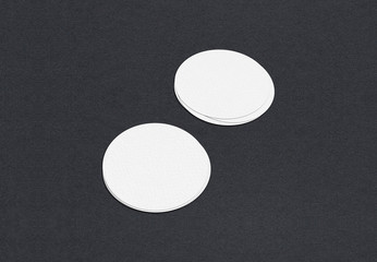 Blank white Business card mockup stacks on grey textured paper background.