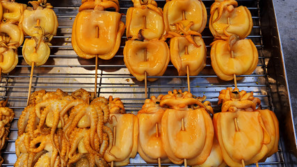 Grilled Squid Popular Street Food In Thailand BBQ Squid On A Stick Grilled Buttered Fresh Squid Many Of Grilled Squid In Thai Market Street Food 