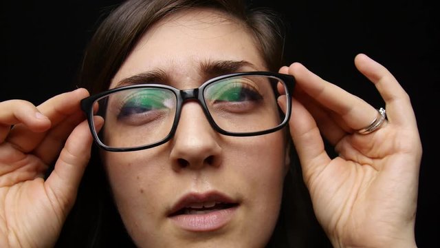 Woman puts on glasses and her world comes into focus.