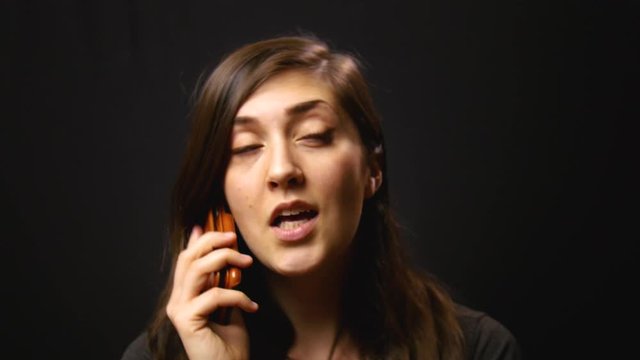 Woman has friendly chat on her cell phone.