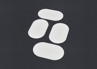 Blank white Business card mockup stacks on grey textured paper background.