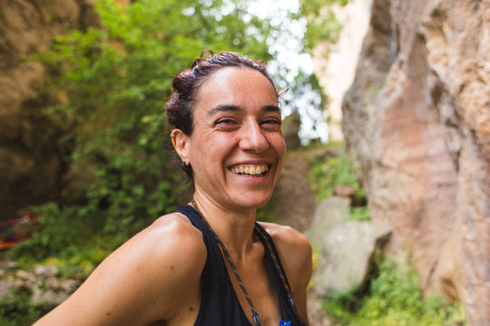 Portrait of a smiling rock climber, The woman is laughing.