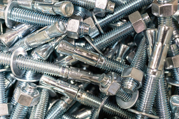 Closeup of Pile of screws and nuts and bolts in a bucket