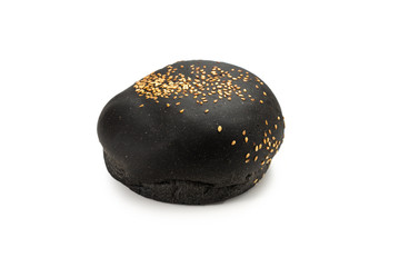 Black burger bread isolated on white.