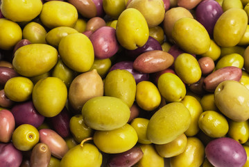 Tasty mix olives background.