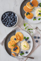 pancakes with vanilla sauce and blueberries