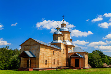 Fototapeta na wymiar Ancient reconstructed wooden church of St. Nicolas in Pyrohiv (Pirogovo) village near Kiev, Ukraine