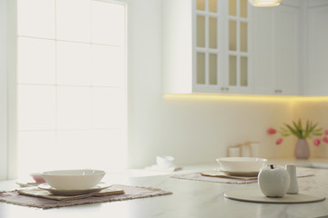 Fototapeta na wymiar Elegant table setting in stylish kitchen interior