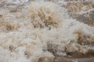 Naklejka na ściany i meble 夏の豪雨で氾濫している川の様子