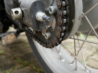 Fototapeta premium closeup of detail a motorcycle rear chain.